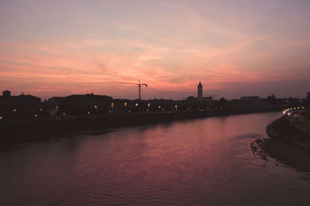 View of the city Verona across the river Adige at sunset , Verona, Italy, Europeの写真素材