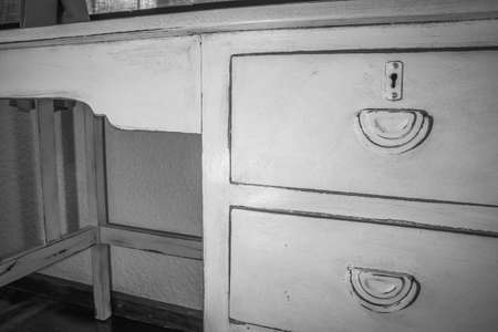 Old White wooden work desk, with three draws, inside a bedroom, South Africaの写真素材