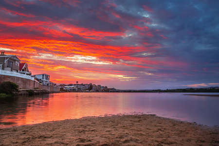 Overcast cloudy sunrise over Mossel bay lagoon. Mossel bay, Western Cape, South Africaの写真素材
