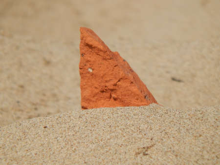 Hot stone in the sandの写真素材
