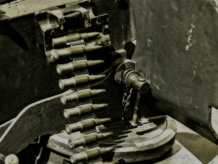 bandolier of bullets from a machine gun. Picture in retro style with the effect of softnessの写真素材