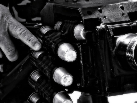 bandolier of bullets from a machine gun. Picture in retro style with the effect of softness