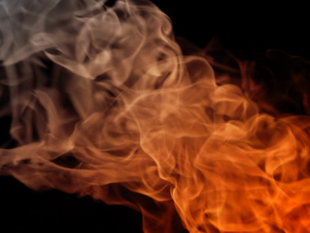 Texture fire flame with smoke on black backgroundの写真素材