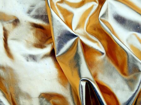 Gold satin fabric close upの写真素材