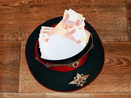 A police cap with money