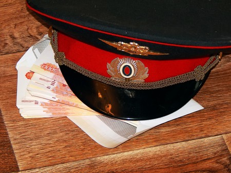 A police cap with moneyの写真素材