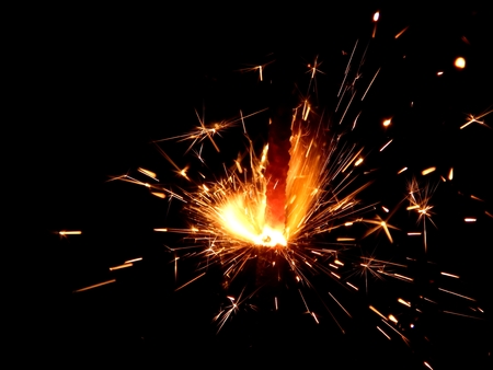 New Year Bengal lights with sparks on a black backgroundの写真素材