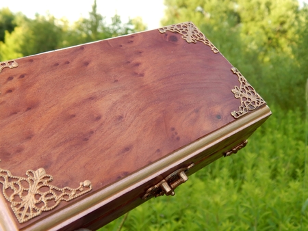 Box of mahogany wawona handmade on a green backgroundの写真素材