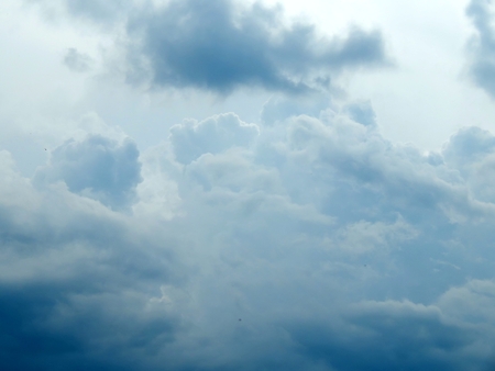 Blue sky with clouds after the rain close upの写真素材