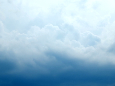 Blue sky with clouds after the rain close upの写真素材