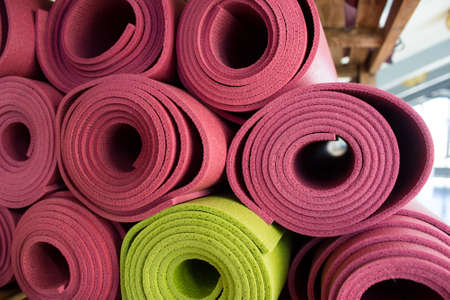 Colorful yoga mats on the shelf.の写真素材
