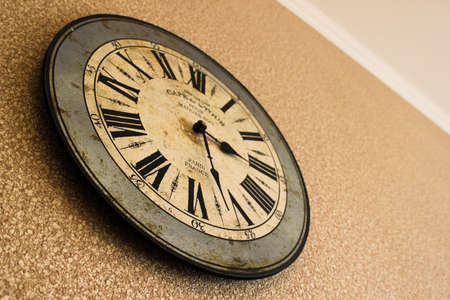 Vintage watch on grunge white wall.の写真素材