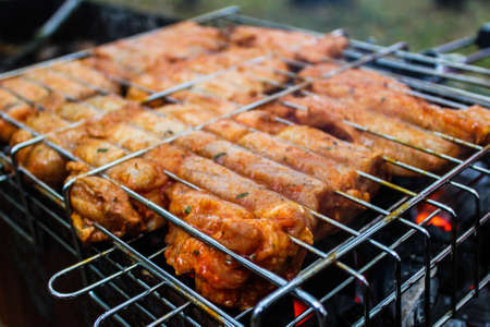 BBQ Chicken Cooking on Grill.の写真素材