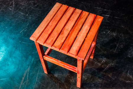 Small four legged wooden step stool over blackの写真素材