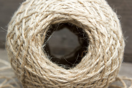 wool ball of threads on wooden table