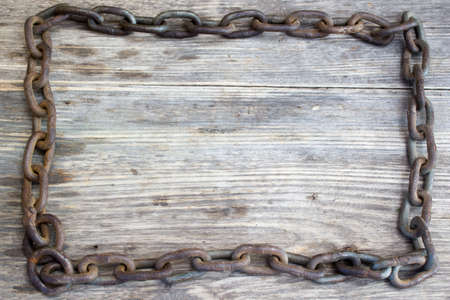 Metal chain on nice old wooden background, Copy space to right.の写真素材