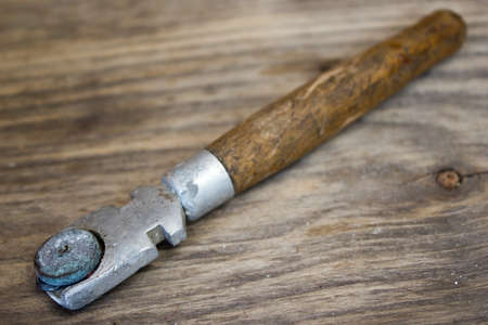 vintage roller point glass cutter On wood backgroundの写真素材