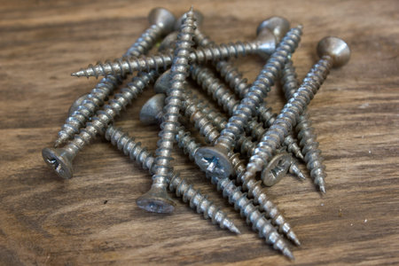 screws on wooden background