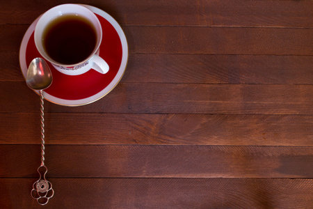 Closeup of cup of tea on wooden background with copy space