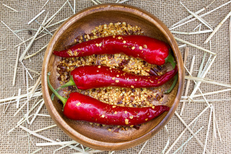 Red hot chili peppers on burlap sack background