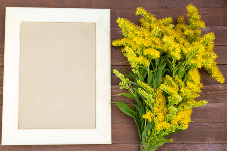 empty picture frame on wooden background