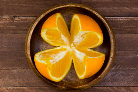 fresh oranges on a wooden backgroundの写真素材