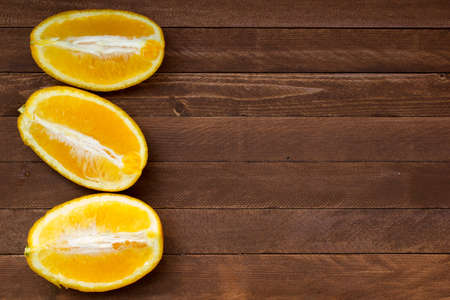 fresh oranges on a wooden background, copy spaceの写真素材