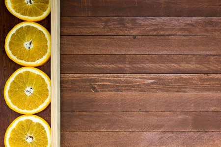 fresh oranges on a wooden background, copy spaceの写真素材
