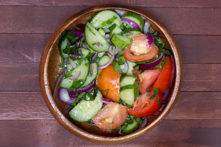 fresh vegetable salad in woodem plateの写真素材