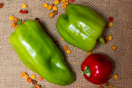 red and green peppers on burlap sackの写真素材
