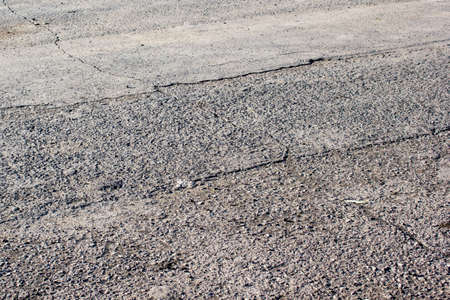 Old gray grungy asphalt road background textureの写真素材