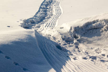 Winter trail, the road in the snowの写真素材