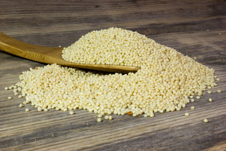 Couscous for a healthy diet on wooden background