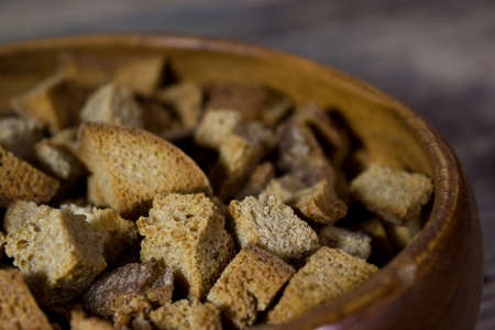 Homemade croutons on wooden backgroundの写真素材