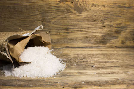 Large sea salt on wooden backgroundの写真素材