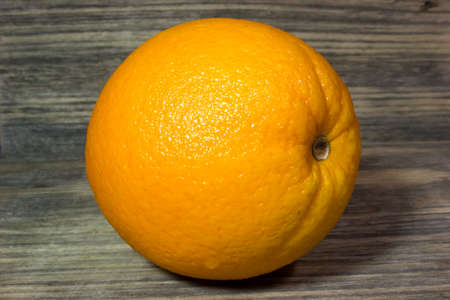 Orange fruits on wooden backgroundの写真素材