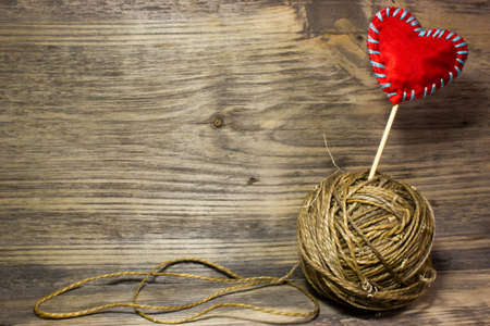The coils of jute rope on wooden background. Free space for text.の写真素材