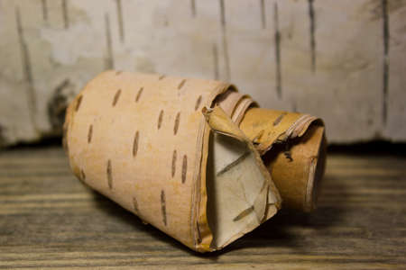 Roll of birch Bark on woodenの写真素材