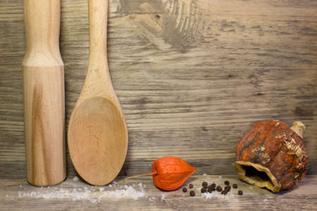 Wooden kitchen spoon on wooden background. Space for text.の写真素材