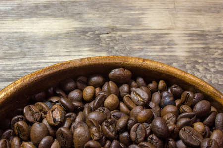 Coffee beans on wooden backgroundの写真素材