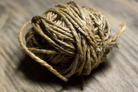 Close up view clew of pack-thread on wood board, Rope coilの写真素材