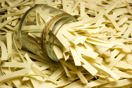 Wide Italian noodles on wooden background