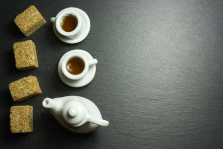 Two cups of tea on a dark background. The view from the top.の写真素材