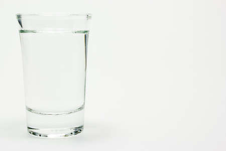 Glass of vodka on whiteの写真素材