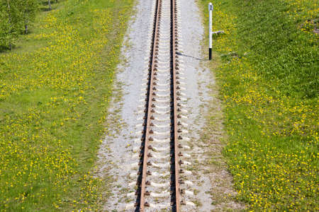 Rail road in green fieldの写真素材