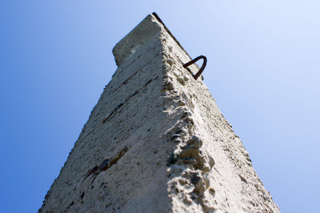 Old concrete structures in the green grassの写真素材