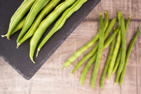 Fresh green beans on woodenの写真素材