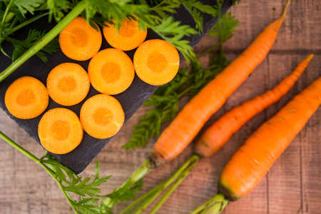 Fresh carrots on woodenの写真素材