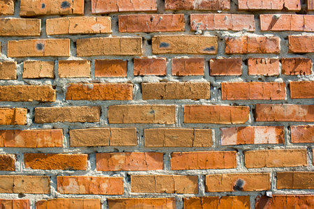 Old destroyed wall from a red brick