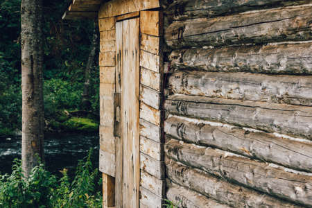 Travel house made of wooden logs, the mountain river.の写真素材